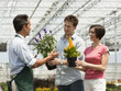 "USA, Utah, Salem, couple buying flowers from gardener"