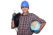 Eager electrician installing electrical systems abroad