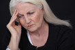 Senior woman with a headache