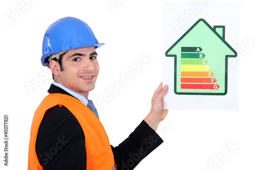 Photo: businessman holding an energy consumption label businessman holding an energy consumption label
