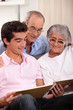 Family looking at a photo album