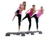young group women training on stepper isolated