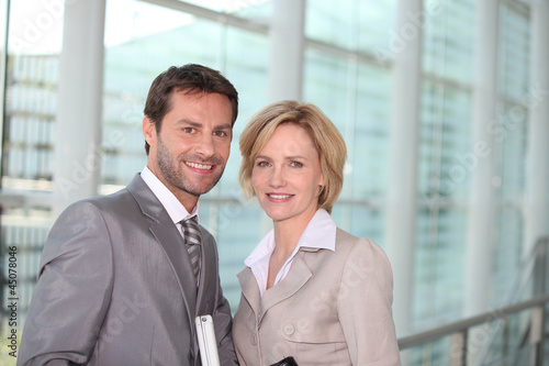 Photo: Business couple smiling Business couple smiling