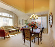 Elegant dining room table with classic furniture and decor.