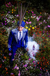 Photo: Man in expensive dark blue suit of illusionist Man in expensive dark blue suit of illusionist