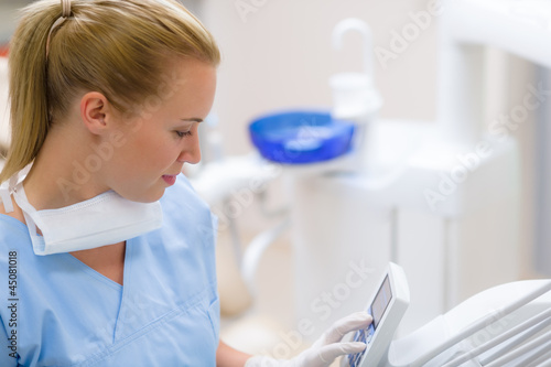 Photo: Dental assistant use orthodontic technology Dental assistant use orthodontic technology