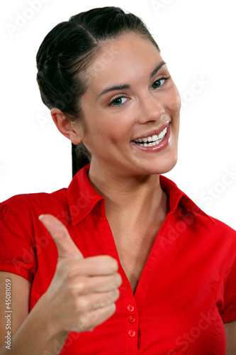 Foto: A businesswoman giving the thumb up. A businesswoman giving the thumb up.