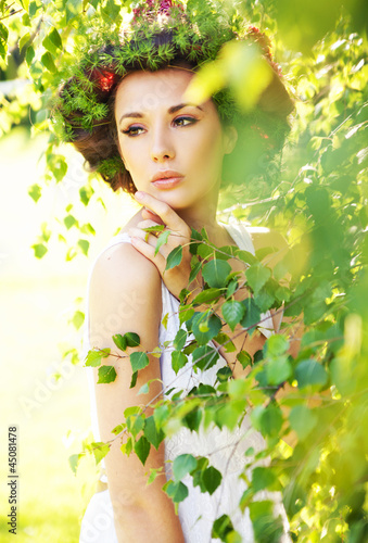 Photo: Cute woman among greenery Cute woman among greenery