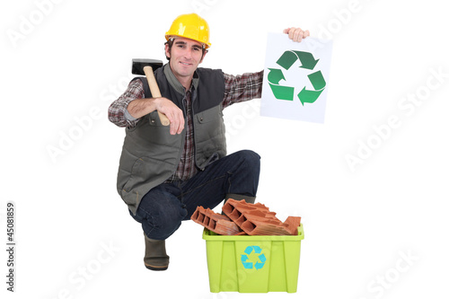 Photo: Builder recycling bricks Builder recycling bricks