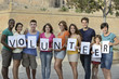Photo: happy and diverse volunteer group happy and diverse volunteer group