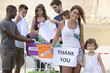 Photo: volunteer group with child saying thank you volunteer group with child saying thank you