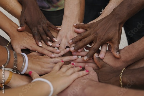 Photo: Many hands together: group of people joining hands Many hands together: group of people joining hands