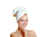 portrait of a beautiful blonde with white towel on her head