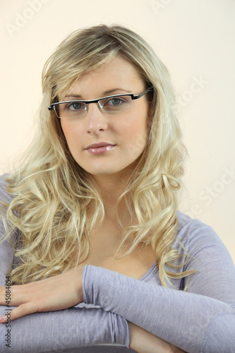 Photo: Portrait of blond woman wearing glasses Portrait of blond woman wearing glasses