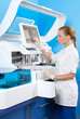 Photo: The woman physician behind work in laboratory The woman physician behind work in laboratory