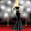 woman posing in front of the paparazzi on the red carpet