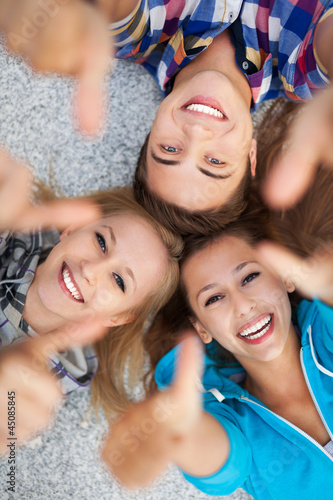 Photo: Young people with thumbs up Young people with thumbs up