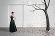 Beautiful girl in front of the tree. A symbol of the fall.