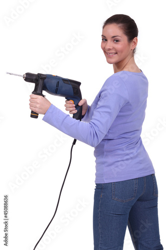 Photo: Woman with drill Woman with drill