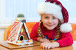 girl with gingerbread house