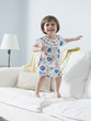 "USA, California, San Francisco, girl (2-3) walking on sofa"