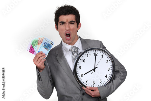 Photo: Animated businessman with clock and money Animated businessman with clock and money