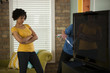 Photo: "USA, Utah, Provo, couple installing new TV set" "USA, Utah, Provo, couple installing new TV set"