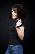 Studio portrait of young woman dancing