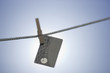 Credit card hanging on washing line