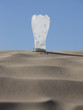 "USA, Utah, Little Sahara, glass of ice cold water in desert"