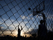 Photo: "USA, Utah, Salt Lake City, two young men playing street basketball" "USA, Utah, Salt Lake City, two young men playing street basketball"