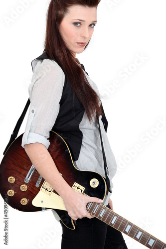 Photo: Woman with electric guitar Woman with electric guitar
