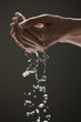 Young woman's hands cupping water
