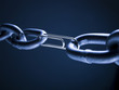 Chain linked with paper clip against blue background