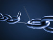 Chain linked with broken paper clip against blue background