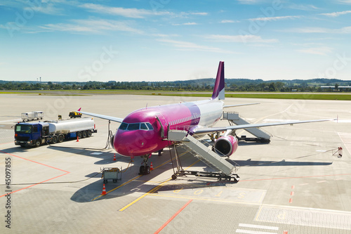 Photo: Large tourist airplane waiting on airport Large tourist airplane waiting on airport