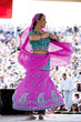 Photo : "USA, Utah, Spanish Fork, mid adult dancer in traditional clothing performing on stage" "USA, Utah, Spanish Fork, mid adult dancer in traditional clothing performing on stage"