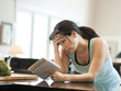 Photo: "USA, Utah, Alpine, mid adult woman leaning to kitchen counter and holding letters in kitchen" "USA, Utah, Alpine, mid adult woman leaning to kitchen counter and holding letters in kitchen"