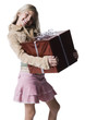 "Girl (10--11) standing with gift, portrait"