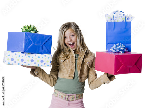 Photo: "Girl (10--11) standing with gifts, portrait" "Girl (10--11) standing with gifts, portrait"