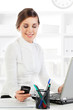 Photo: Young smiling woman at work Young smiling woman at work
