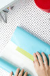 "USA, California, San Francisco, young woman wrapping gift"