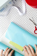 "USA, California, San Francisco, young woman wrapping gift"