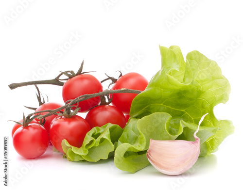 Photo: Fresh lettuce salad leaves bunch and cherry tomato Fresh lettuce salad leaves bunch and cherry tomato