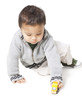 Studio shot of boy (18-23 months) playing with toy car