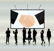 Business people in front of a billboard