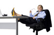 Studio portrait of businesswoman relaxing at desk
