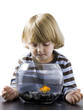 "USA, Utah, Provo, Boy (2-3) watching goldfish in bowl"