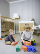 "USA, Utah, Provo, Two boys (18-23 months,2-3) playing with building blocks"