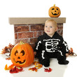 Tiny Skeleton Among Pumpkins
